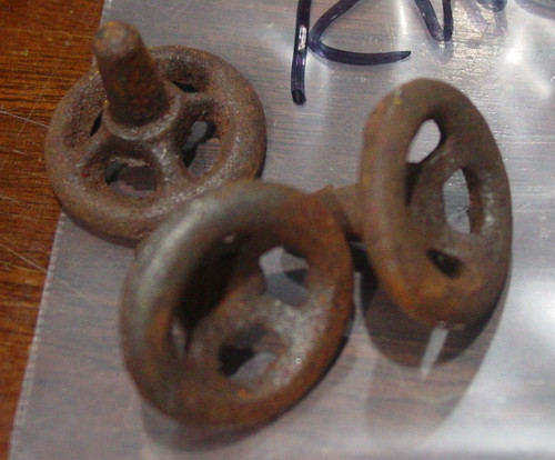 One antique cast iron steering - one,